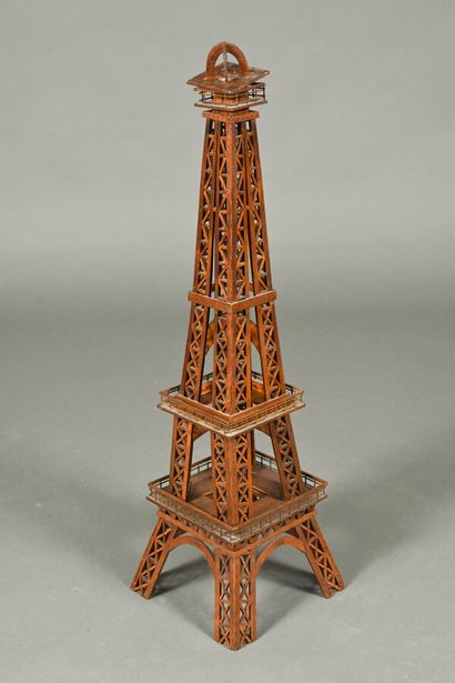 Two decorative Eiffel Towers, one in metal,...