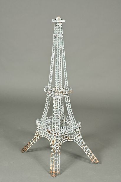 Two decorative Eiffel Towers, one in metal,...
