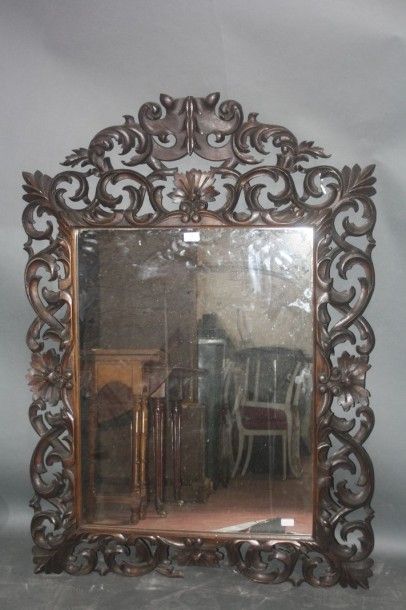 Miroir à profil inversé en bois sculpté et...