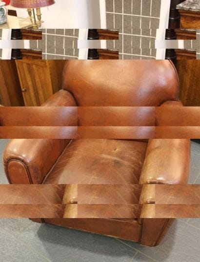 Fauteuil Club en cuir fauve.