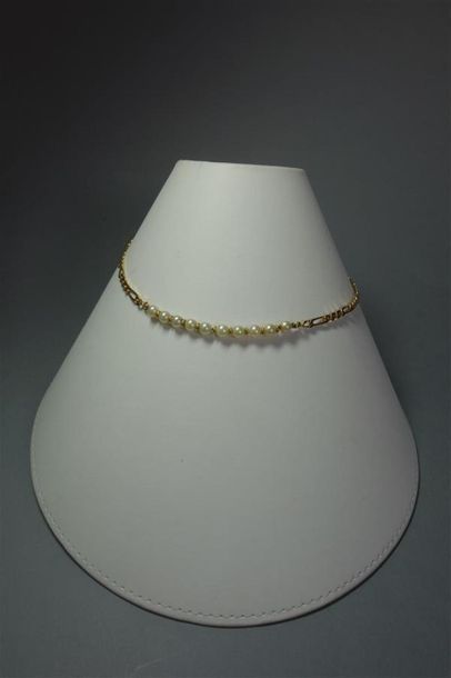 Collier en or jaune 18K (750/oo) maille gourmette...