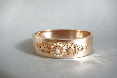 Bracelet jonc ouvrant en or jaune 18K (750/oo),...