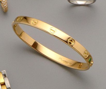CARTIER : Bracelet jonc rigide ouvrant en...