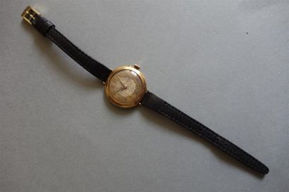 Montre en or jaune 18K (750/oo), cadran rond...