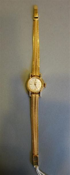 PHILIPPE : Montre de dame en or jaune 18K...