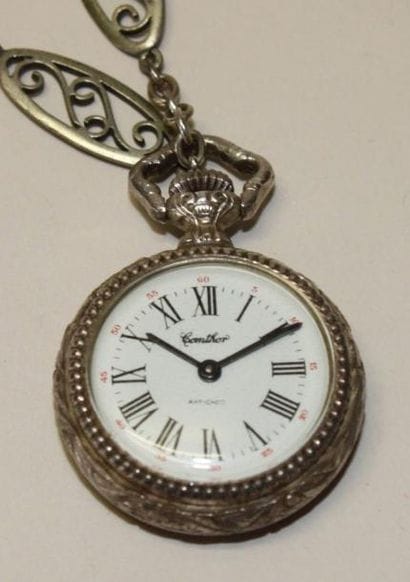 COMTHOR
Petite montre de gousset et sa chaîne...