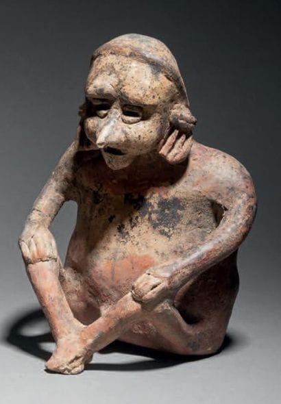 HOMME ASSIS
DANS UNE ATTITUDE DE REPOS
CULTURE...