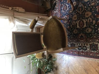 Pair of white painted molded wood armchairs...