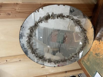 Circular mirror
Decorated with a foliated...