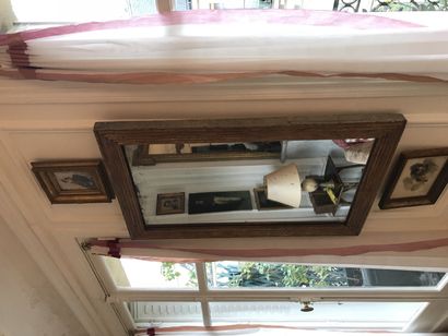 Two mirrors in the Louis XVI style In carved...