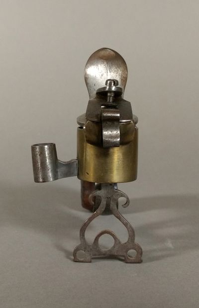 A brass and iron flintlock table lighter...