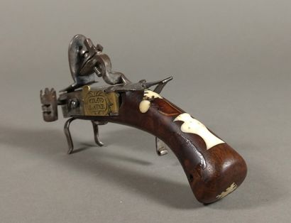 Brass and iron flint table lighter with bone...