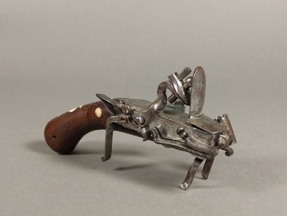 Brass and iron flint table lighter with bone...