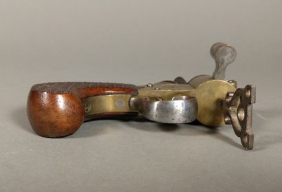 A brass and iron flintlock table lighter...