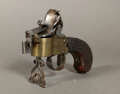 A brass and iron flintlock table lighter...