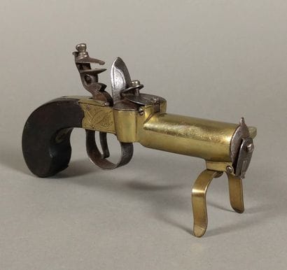Brass and iron flint table pistol lighter...