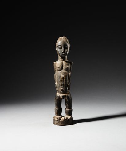 Baule male figure, Ivory Coast
Wood
H. 24...