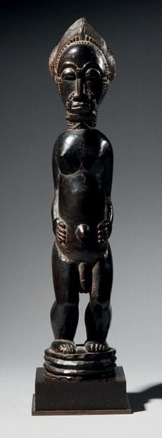 Baule male figure, Ivory Coast
Wood
H. 43...