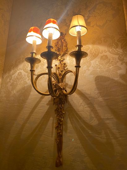 Pair of three arms sconces in gilt bronze
Model...