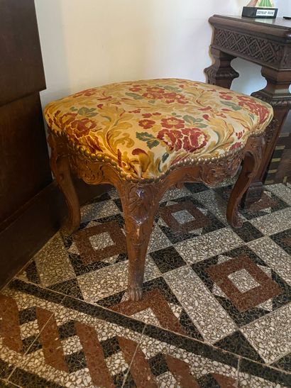 Suite of four stools in natural wood richly...