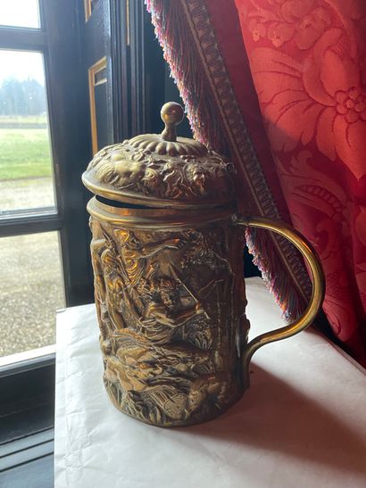 Important covered copper mug with repoussé...