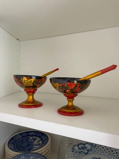 
Two caviar cups with two spoons in red,...
