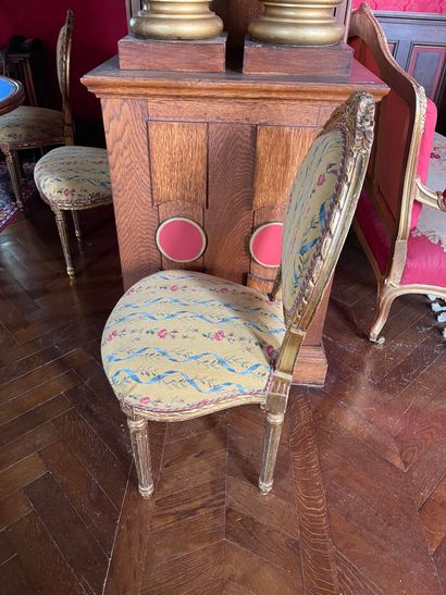 Suite of eight carved and gilded wood chairs
Fluted...