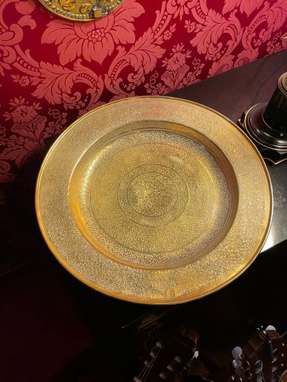Important circular copper dish richly engraved...