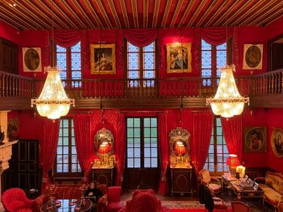Suite of three pairs of curtains in red damask...