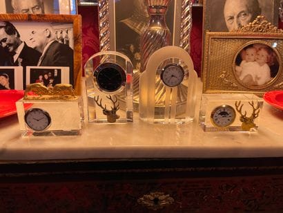 Set of four glass clocks, some with bronze...