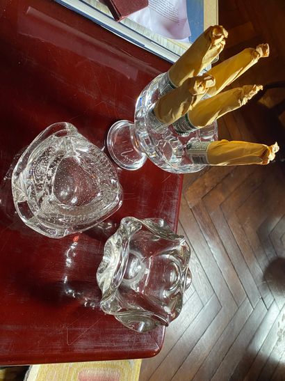Two glass ashtrays, one of which is bubbled
A...