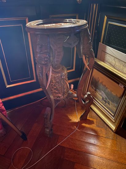In the library:
Tripod natural wood saddle...