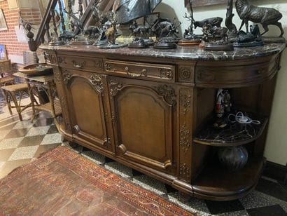 Important sideboard in oak richly carved...