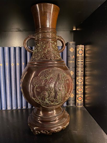 A pair of bronze baluster vases with brown...