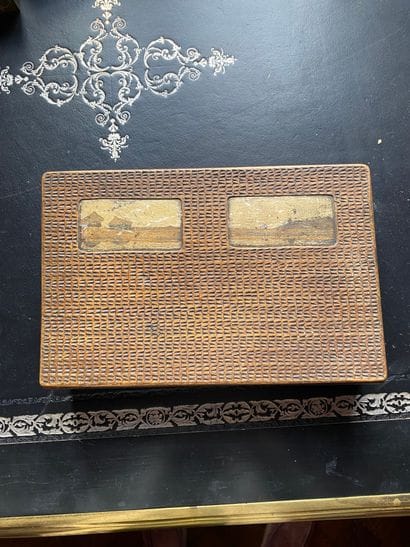 Rectangular wooden box decorated with two...