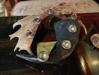 Set of two candelabras decorated with elk...
