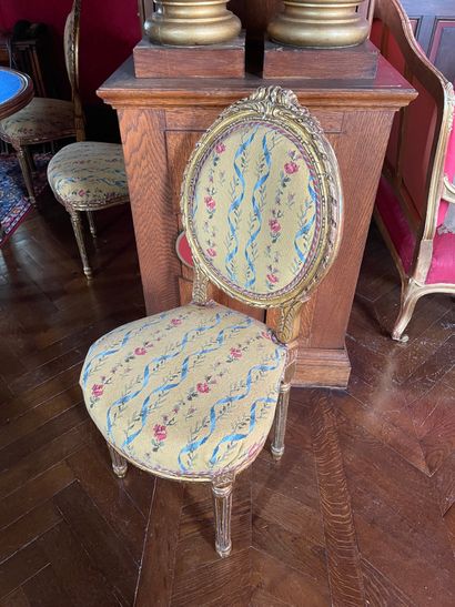 Suite of eight carved and gilded wood chairs
Fluted...