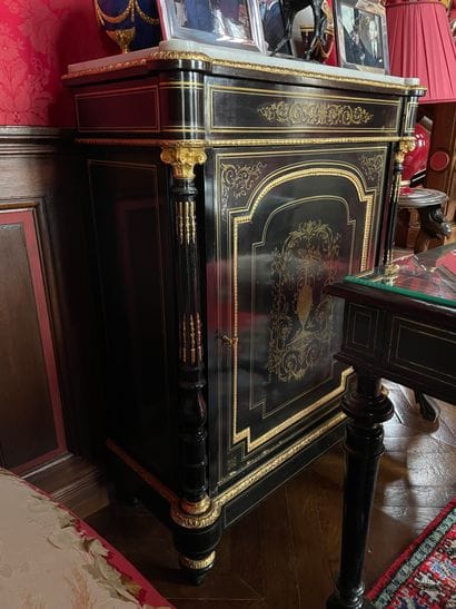 Blackened wood and brass marquetry cabinet
Toupie...