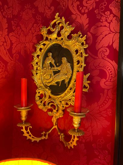 Pair of gilded and patinated bronze sconces
Decorated...