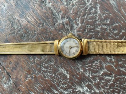 REXA lady's watch bracelet In gold 750°/°°
Round...