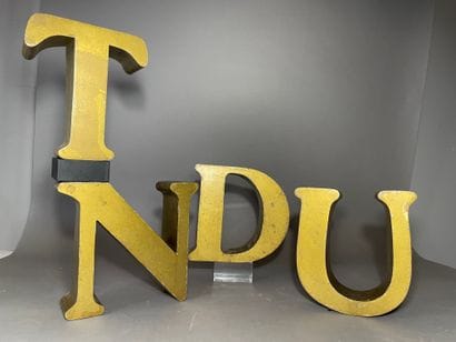 Set of 4 letters in golden sheet
D.U.N.T...