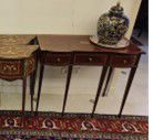 Console table with tapered legs
Opening with...