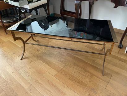 Coffee table
The black glass top
Gold-plated...