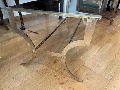Coffee table
The black glass top
Gold-plated...