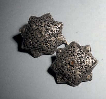 Two ornaments, Tibet 19th century H. 6,5...