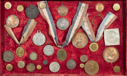 Framing containing about twenty badges of...