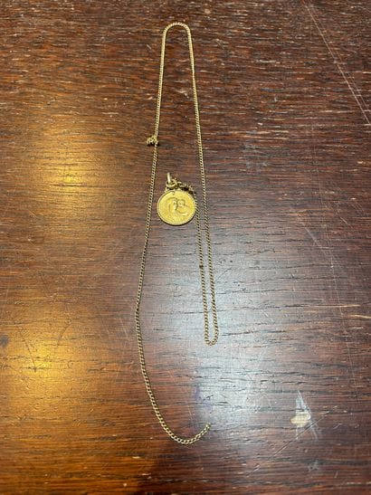 Lot in gold 750°/°° including :
A scrap of...