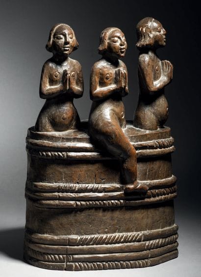 Three children in an oak salt cellar carved...