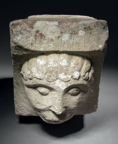 Limestone modillion carved in high relief...
