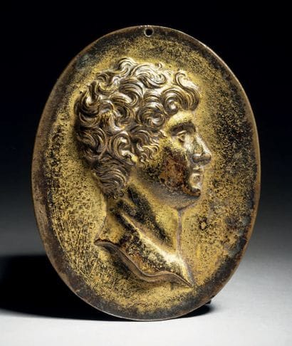 Oval plaque in gilded bronze depicting in...